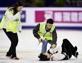 Hanyu manages silver after warm-up collision
