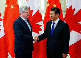 Canada PM Harper, China Pres. Xi hold talks in Beijing