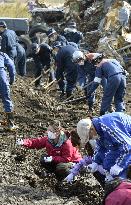 Families, police search for missing victims of 2011 quake