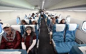 People take demonstration ride on Maglev train
