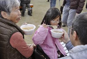 People enjoy cooked anglerfish at festival