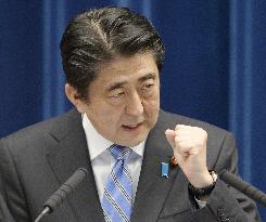 Abe announces plan to dissolve lower house, postpones tax hike