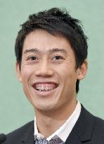 Nishikori smiles at press meet in Tokyo