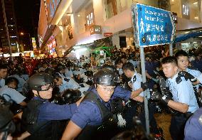Police push demonstrators out of occupation site