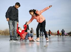 Children skate on frozen river in Ulan Bator