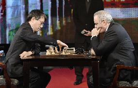 Japan's shogi champ beaten by ex-chess king