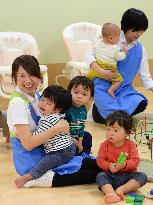 Kids play in nursery room opened at health ministry