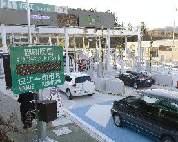 Cars pass by radiation dosimeter in Fukushima Pref.