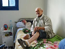 Leprosy patient shows amputated leg in Morocco