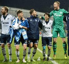 Schalke's defender Uchida celebrates with teammates