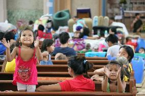 Philippine children take shelter at church