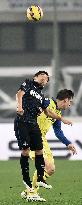 Nagatomo of Milan struggles for header against Chievo