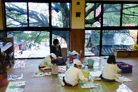Kyoto nursery school kids draw pictures