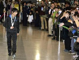 Figure skater Hanyu returns home