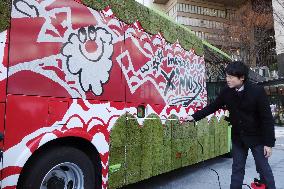 Moss-covered bus unveiled in Osaka