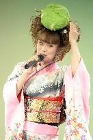 Osaka pop ballad diva sings with ornament on head