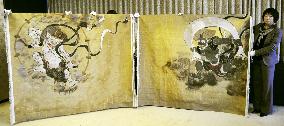 Craftsmen re-create folding-screen painting with brocade