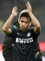 Inter Milan's Nagatomo reacts to cheers from supporters