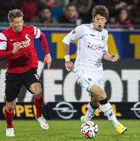 Hannover's Sakai in action against Freiburg player