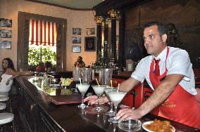 Bartender serves drinks at famous Havana bar