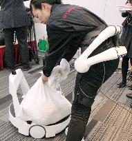 Wearable, transport robots demonstrated in Tokyo