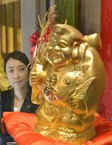 Pure gold Ebisu statuette displayed at Osaka jewelry shop