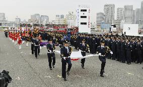 Honor guard marches during Tokyo New Year fire drill
