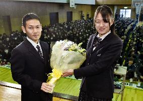 Japan pro boxer Takayama gets flowers from peer student