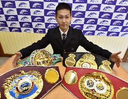 Japan pro boxer Takayama shows off 4 world champ belts
