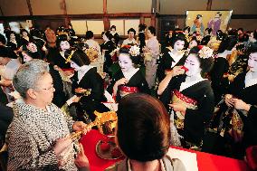 "Geisha" attend New Year ceremony to kick off work