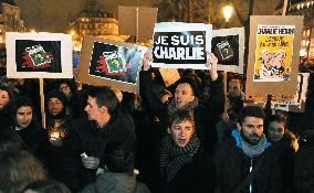Parisians in solidarity with weekly after shooting rampage