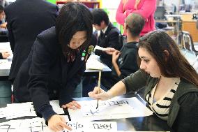 Japanese high schooler teaches U.S. student calligraphy