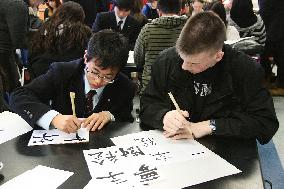 Japanese high schooler teaches U.S. students calligraphy