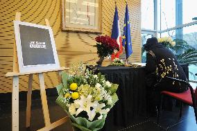 Visitor signs condolence note at French embassy in Beijing
