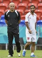 Palestine coach watches practice before game vs. Japan