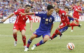 Japan MF Muto competes for ball in Asian Cup match