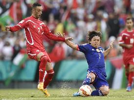 Japan MF Endo competes for ball in Asian Cup game