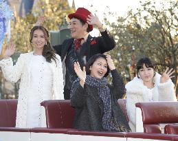 Guests wave in 'Frozen' parade at Tokyo Disneyland