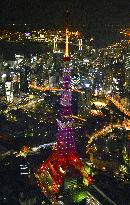 Tokyo Tower lit in cherry color before college entrance exam