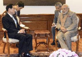 Japanese Foreign Minister Kishida talks with Indian PM Modi