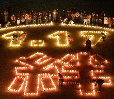 "1.17" formed with candles on 20th Hanshin quake anniv.