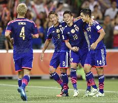 Japan reach quarterfinals in Asian Cup