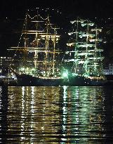 Japanese, Russian sailboats lit up at Nagasaki port festival