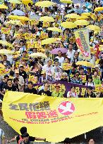 H.K. protesters march ahead of vote on electoral package