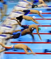 Olympic scenes: Butterfly swimmers dive in