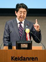 Abe urges business leaders to raise wages