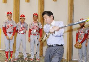 Abe with young baseball players