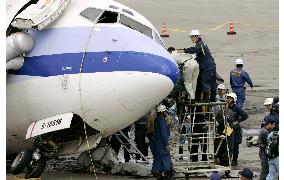 Japan, Taiwan examine plane at Naha airport