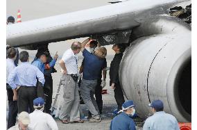 Inspectors check debris of China Airlines jet