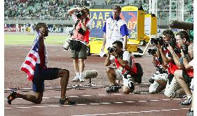 Gay poses after claiming gold double with title in 200